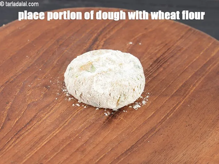 Step 17 – Place a portion of the dough coated with whole wheat flour.