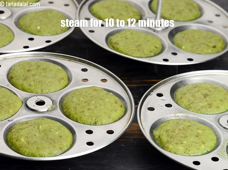 Step 17 – Steam in a steamer for 10 to 12 minutes or till the idlis are cooked.