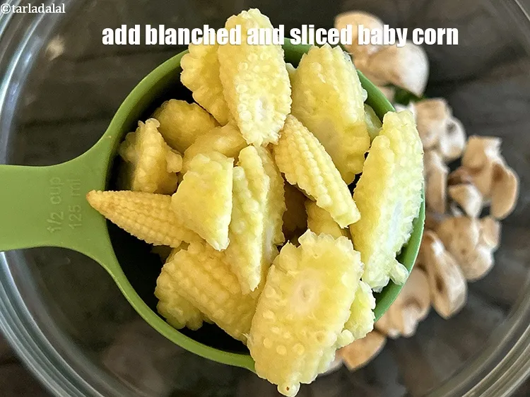 Step 24 – Add&nbsp;<meta charset="UTF-8" />1/2 cup&nbsp;<a href="glossary-diagonally-cut-and-blanched-baby-corn-2308i">diagonally cut and blanched baby corn</a>.