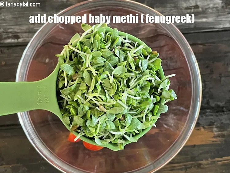 Step 18 – Add&nbsp;<meta charset="UTF-8" />1/2 cup&nbsp;chopped baby fenugreek (methi)&nbsp;.