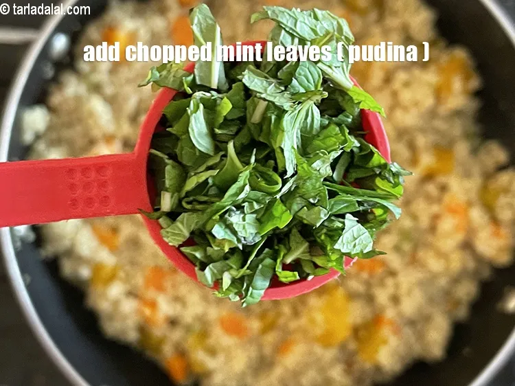 Step 22 – Add&nbsp;<meta charset="UTF-8" />1/4 cup&nbsp;finely&nbsp;<a href="glossary-chopped-mint-788i">chopped mint leaves (phudina)</a>.