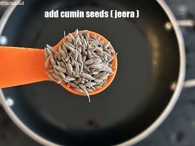 Step 17 – <html><head></head><body><p>Add&nbsp;1 tsp&nbsp;<a href="glossary-cumin-seeds-jeera-zeera-381i">cumin seeds (jeera)</a>.</p></body></html>