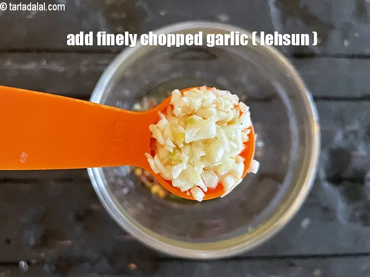 Step 17 – Add&nbsp;<meta charset="UTF-8" />1 tsp&nbsp;finely&nbsp;<a href="glossary-chopped-garlic-790i">chopped garlic (lehsun)</a>.
