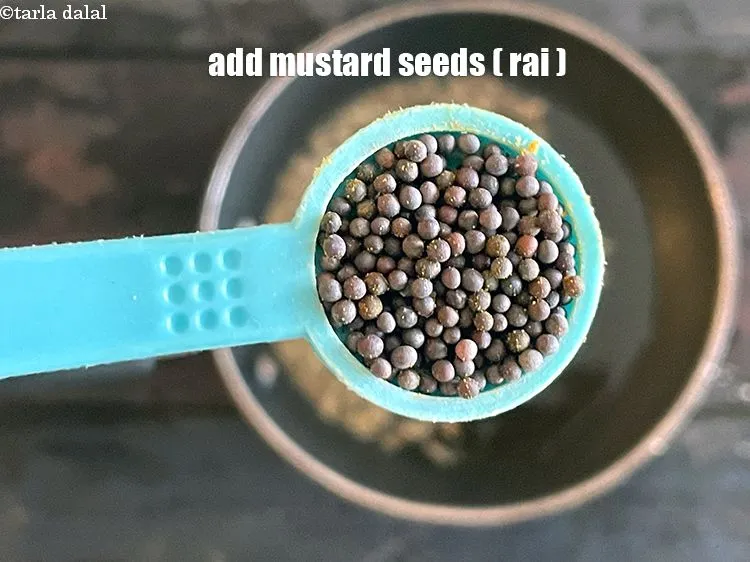 Step 17 – Add&nbsp;<meta charset="UTF-8" />1/2 tsp&nbsp;<a href="glossary-mustard-seeds-sarson-rai-sarson-ke-beej-525i">mustard seeds ( rai / sarson)</a>.