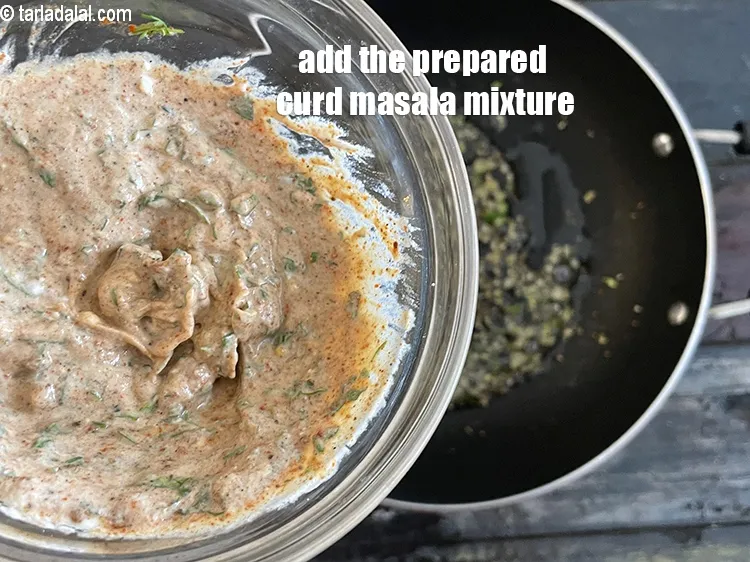 Step 28 – Add the prepared masala curd mixture.&nbsp;