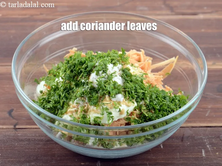 Step 17 – Add &frac14; cup <a href="https://www.tarladalal.com/glossary-coriander-dhania-kothmir-369i">coriander (dhania)</a> leaves.