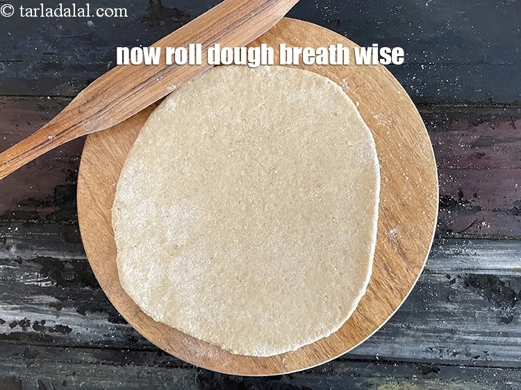 Step 19 – Now roll the dough breadth wise.