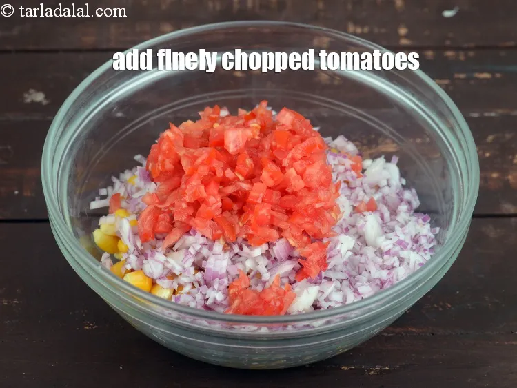 Step 23 – Add 1/4 cup&nbsp;finely&nbsp;<a href="https://www.tarladalal.com/glossary-chopped-tomatoes-779i">chopped tomatoes</a>.