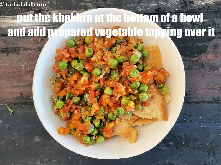 Step 22 – Just before serving put&nbsp;the&nbsp;<meta charset="UTF-8" />2 cups&nbsp;<a href="glossary-crushed-whole-wheat-khakhra-2322i">coarsely crushed whole wheat khakhras</a> in a serving …