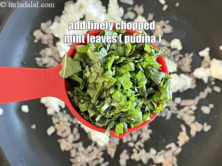 Step 26 – Add&nbsp;<meta charset="UTF-8" />1/4 cup&nbsp;finely&nbsp;<a href="glossary-chopped-mint-788i">chopped mint leaves (phudina)</a>.