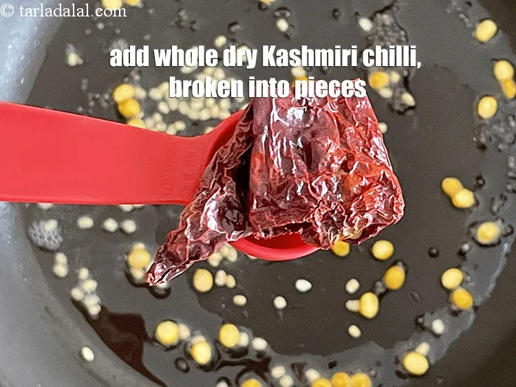 Step 17 – Add 2&nbsp;<a href="glossary-whole-dry-kashmiri-red-chillies-kashmiri-mirch-kashmiri-lal-mirch-332i">whole dry kashmiri red chilli</a>&nbsp;, broken into pieces.