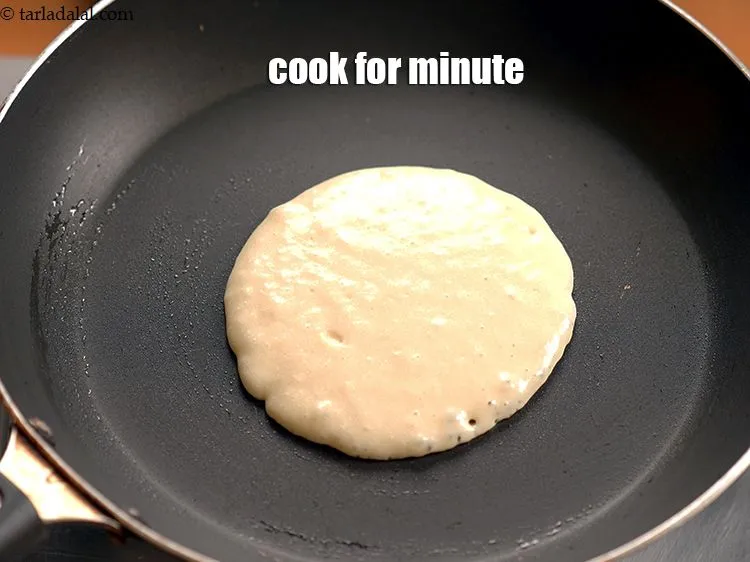 Step 17 – Cook on slow flame for a minute until the blisters appear on pancake.