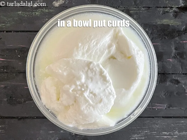Step 17 – <meta charset="UTF-8" /> In a bowl put 1 1/2 cups&nbsp;whisked&nbsp;<a href="glossary-thick-curds-2097i">thick curds (dahi)</a>.&nbsp;<meta charset="UTF-8" />take …