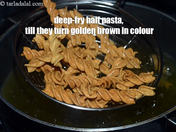 Step 17 – Deep-fry half the pasta, till they turn golden brown in colour from all the sides.&nbsp;
