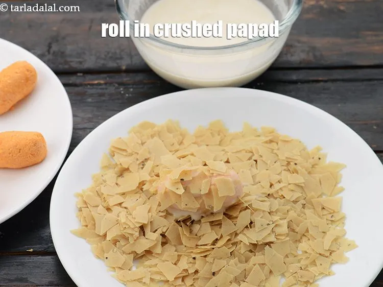 Step 17 – Then roll in the crushed papad.