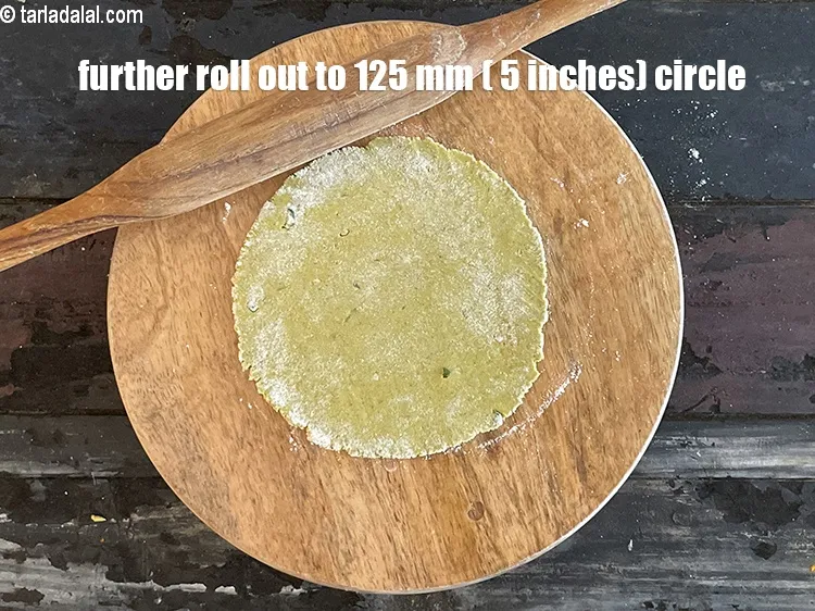 Step 32 – Further roll &nbsp;the dough into a 125 mm. (5&quot;) diameter thin circle, using a little …