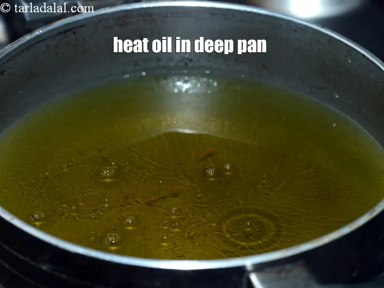 Step 18 – Heat the oil in a deep non-stick pan.