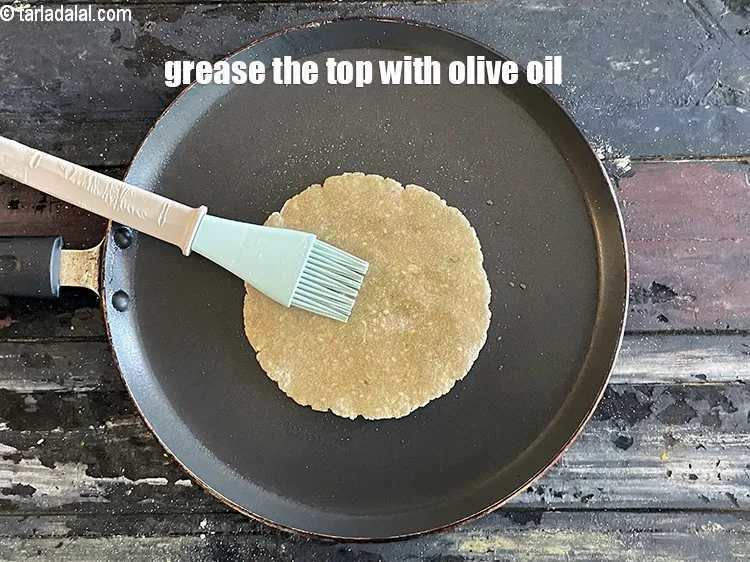 Step 18 – Grease the top with olive oil.