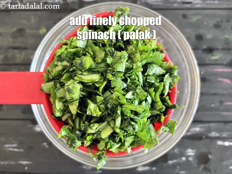 Step 26 – Add&nbsp;<meta charset="UTF-8" />1 cup&nbsp;finely&nbsp;<a href="glossary-chopped-spinach-780i">chopped spinach (palak)</a>.