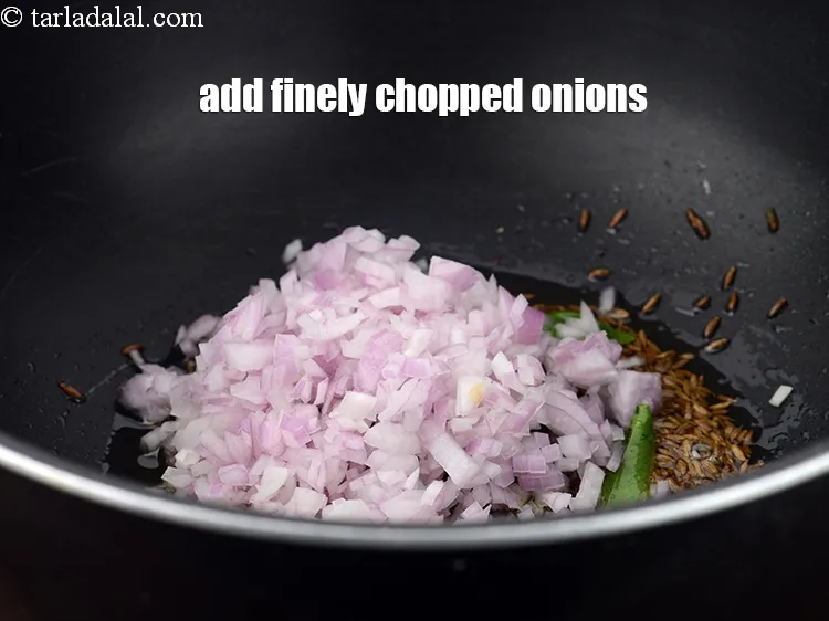 Step 18 – Add &frac12; cup finely&nbsp;<a href="https://www.tarladalal.com/glossary-chopped-onions-722i">chopped onions</a>.