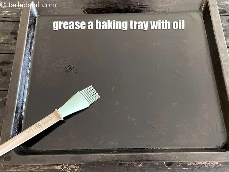 Step 18 – <meta charset="UTF-8" />Grease a&nbsp;baking tray with oil.&nbsp;&nbsp;<br /> &nbsp;
