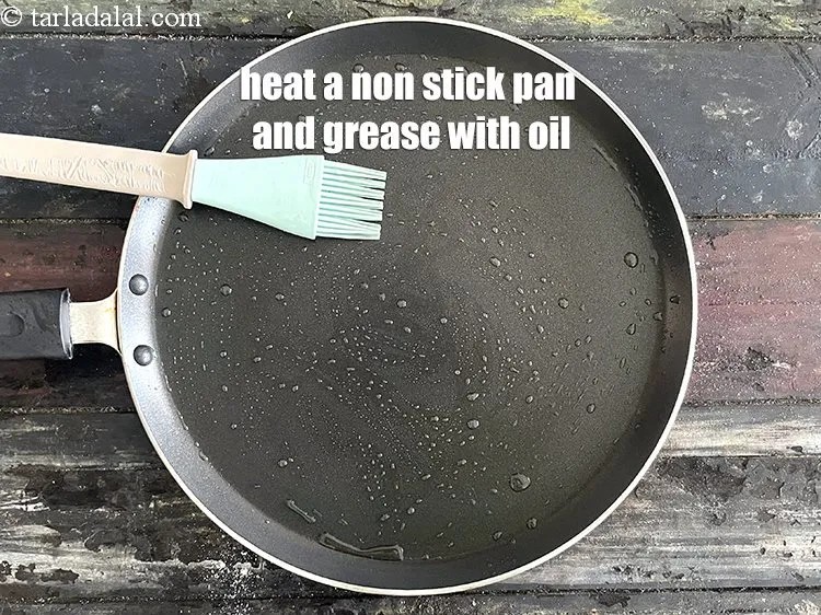 Step 18 – Heat a non-stick tava (griddle) and grease it with 1 tsp of oil.