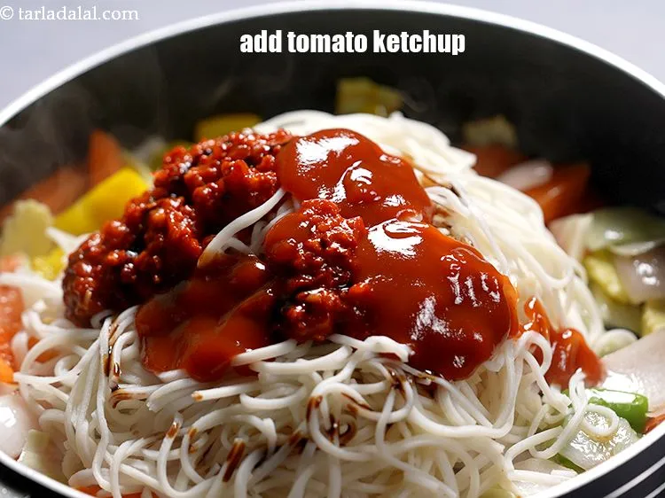 Step 25 – Add 2 tbsp&nbsp;<a href="https://www.tarladalal.com/glossary-tomato-ketchup-tomato-sauce-181i">tomato ketchup</a>.&nbsp;