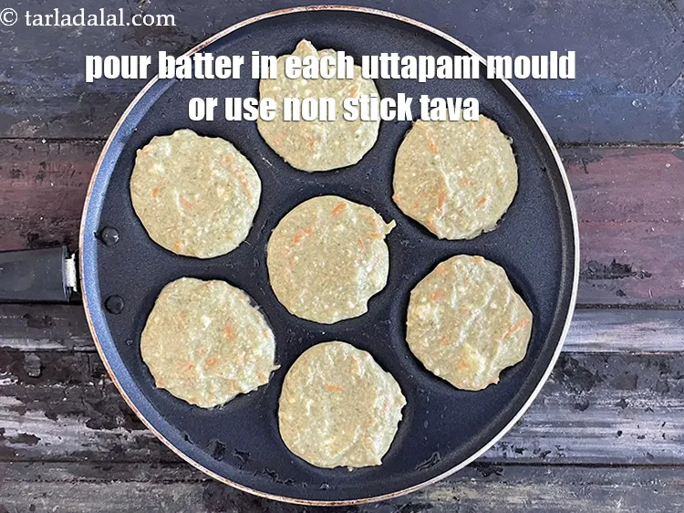 Step 24 – Pour 1 tbsp of the batter in each uttapa mould and spread it lightly.