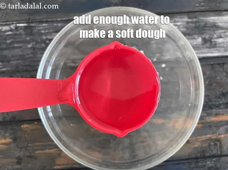 Step 18 – Add enough water to knead into a soft dough. We added 1/4 cup water initially …