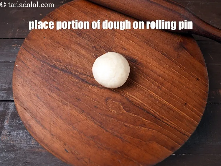Step 17 – Place a portion of the dough on a rolling pin.