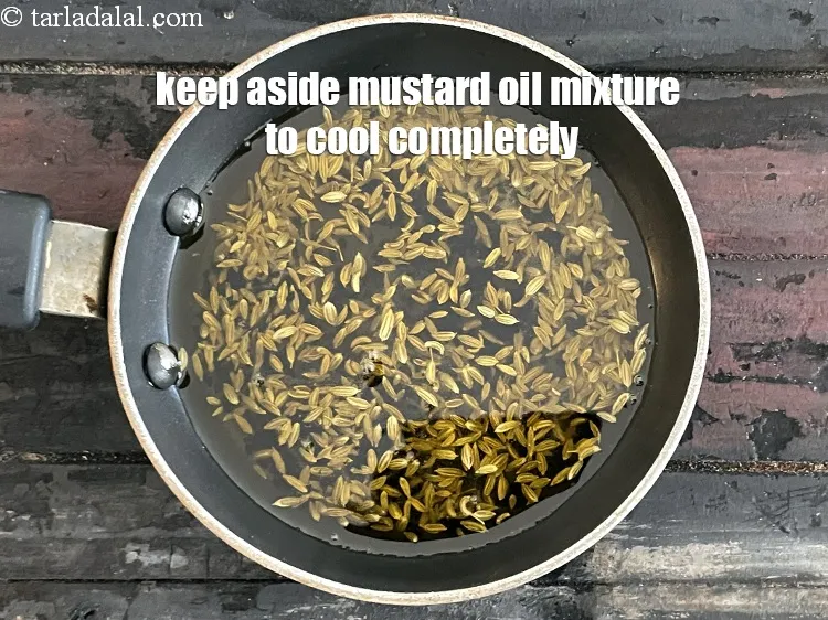 Step 25 – Keep aside to cool the <strong>mustard oil mixture</strong> completely.