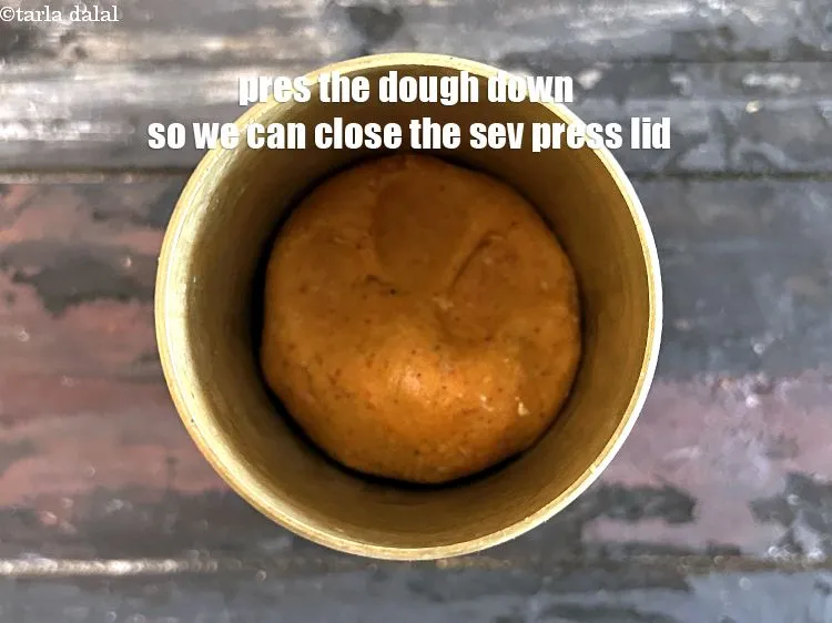 Step 23 – Press the dough down so that we can close the sev press lid.