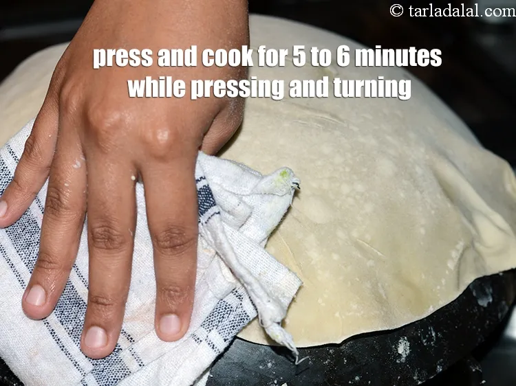 Step 31 – Press and cook the rumali roti on low flame evenly at the egdes to make …