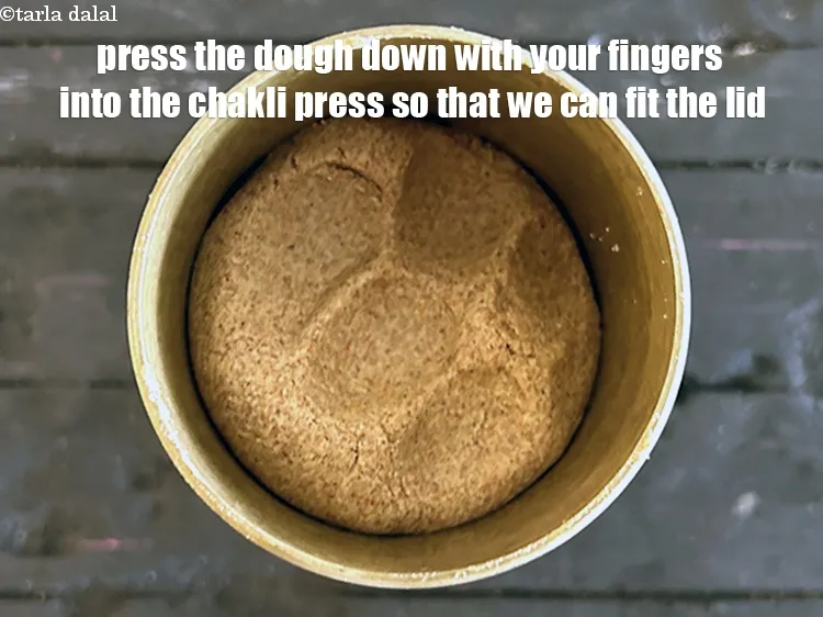 Step 19 – Press the dough down with your fingers into the chakli press so that we can …