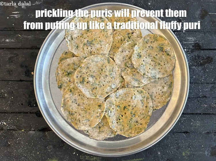 Step 26 – <meta charset="UTF-8" /> Pricking the <strong>methi dhania crispy puris</strong> will prevent them from puffing up …