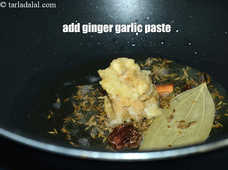 Step 17 – When the cumin seeds crackle, add 1 tbsp <a href="https://www.tarladalal.com/glossary-ginger-adrak-453i">ginger (adrak)</a>&nbsp;<a href="https://www.tarladalal.com/glossary-garlic-paste-lehsun-ki-paste-lahsun-ki-paste-350i">garlic (lehsun) paste</a>.