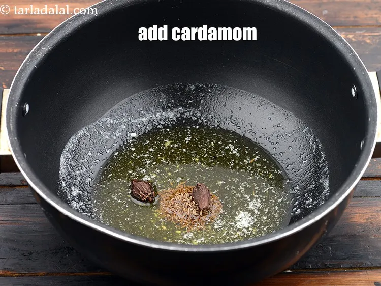Step 18 – Add 2&nbsp;big&nbsp;<a href="https://www.tarladalal.com/glossary-cardamom-elaichi-262i">cardamoms (elaichi)</a>.