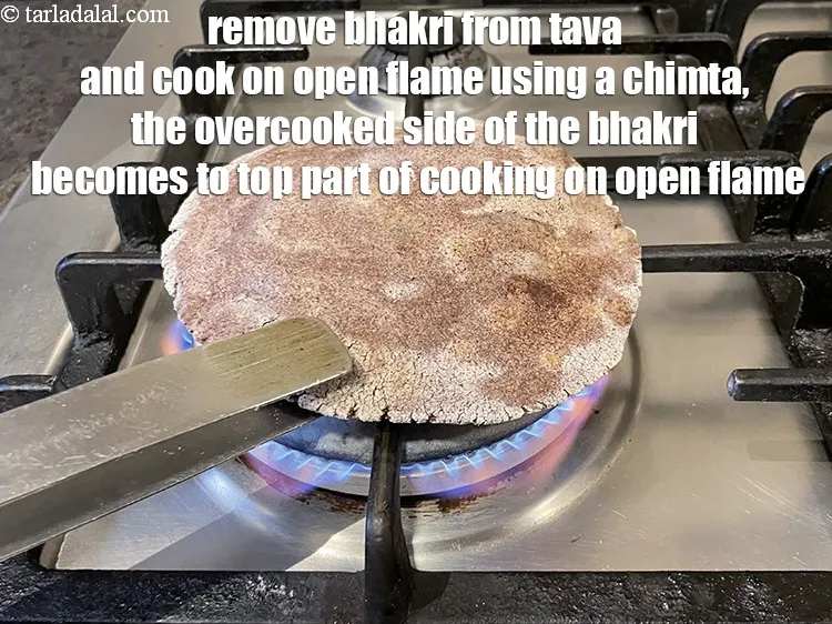 Step 18 – Remove bhakri from tava and cook on a high open flame using a chimta.&nbsp;The overcooked …