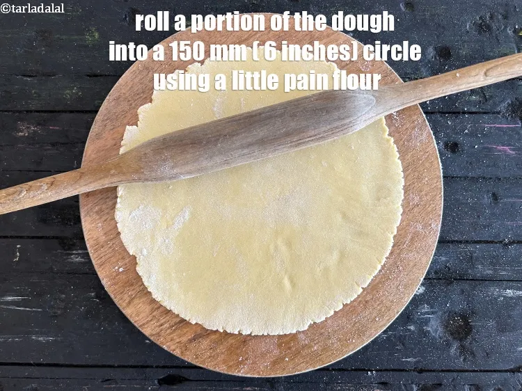 Step 17 – <meta charset="UTF-8" />Roll a portion of the dough into a 150 mm (6&rdquo;) diameter circle …