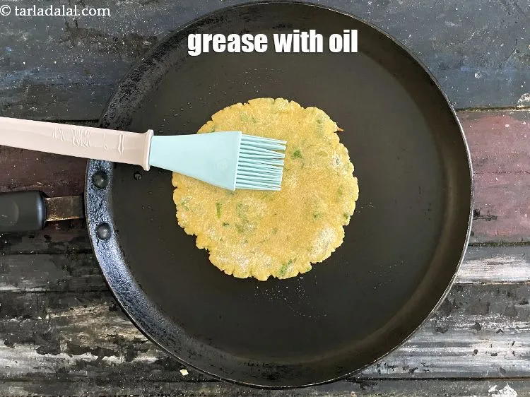 Step 19 – Then grease the top of the roti with little oil.&nbsp;
