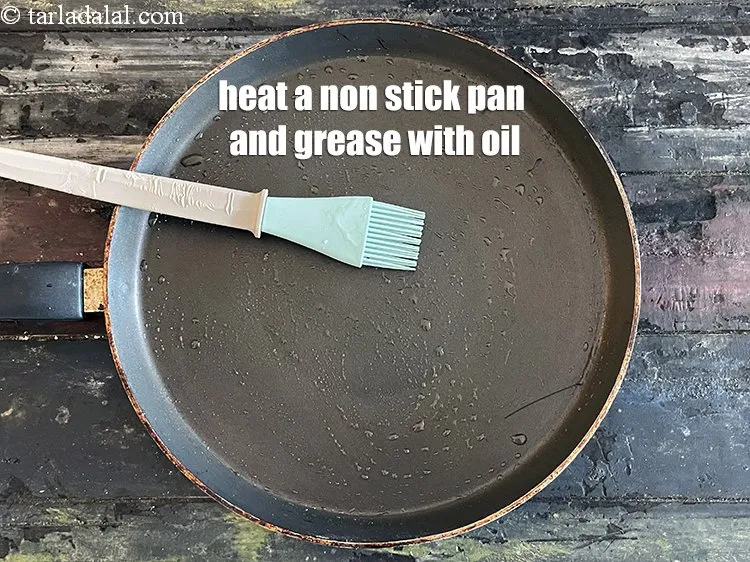 Step 17 – <p>Heat a non-stick tava (griddle) and grease it will little oil.</p>
