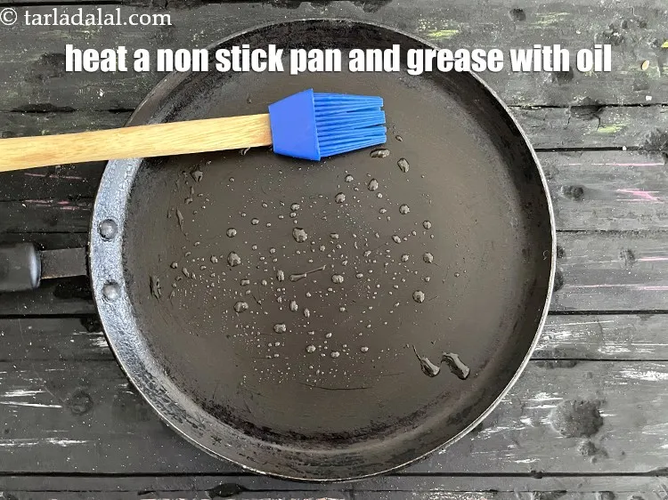Step 20 – <meta charset="UTF-8" />Heat a non-stick tava (griddle) anf grease it with oil.