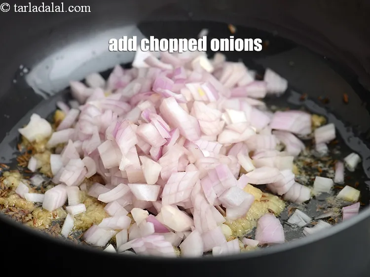 Step 18 – Add 1 cup <a href="https://tarladalal.com/glossary-chopped-onions-722i">chopped onions</a>.