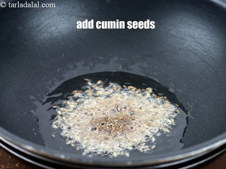 Step 17 – Add 1 tsp&nbsp;<a href="https://www.tarladalal.com/glossary-cumin-seeds-jeera-zeera-381i">cumin seeds (jeera)</a>.