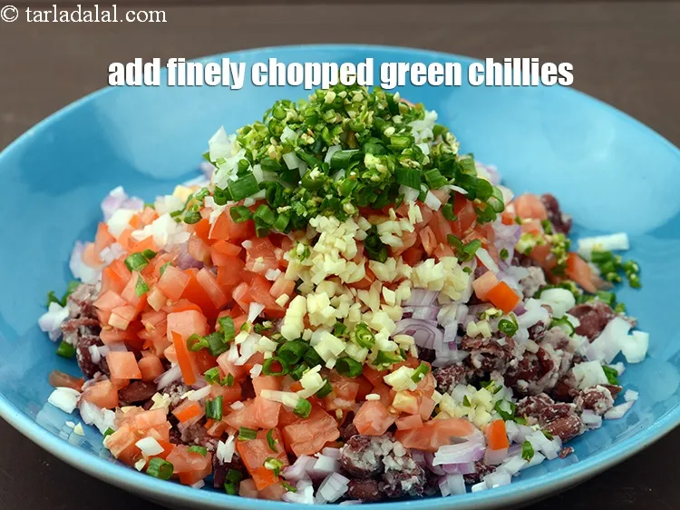 Step 17 – Add 1 tbsp finely <a href="https://www.tarladalal.com/glossary-chopped-green-chilli-820i">chopped green chillies</a>.