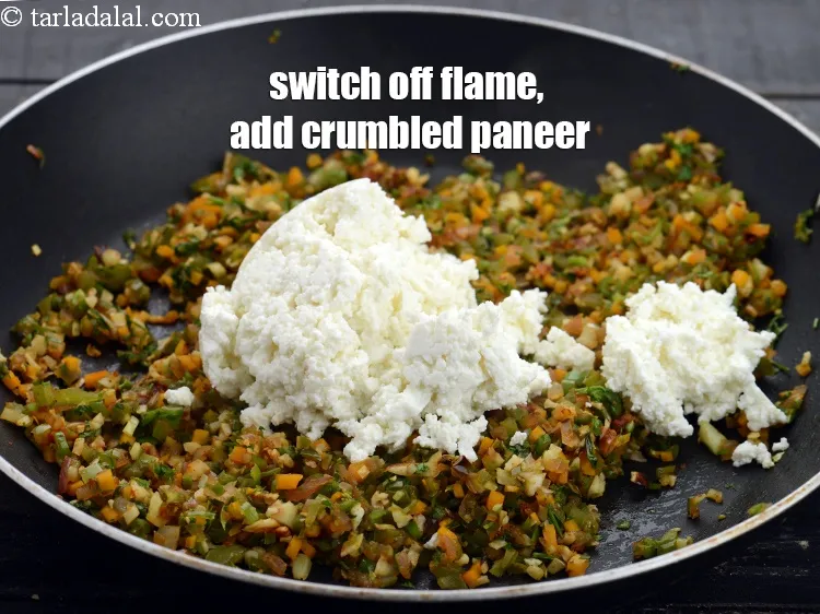 Step 17 – Switch off the flame, add 1/2 cup crumbled <a href="https://www.tarladalal.com/glossary-paneer-cottage-cheese-chenna-985i">paneer (cottage cheese)</a>.