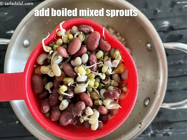 Step 18 – Add<strong>&nbsp;<meta charset="UTF-8" /></strong>1&nbsp;cup&nbsp;<a href="glossary-boiled-mixed-sprouts-1663i">boiled mixed sprouts</a>&nbsp;(red chana, chawli, moong, rajma etc.)
