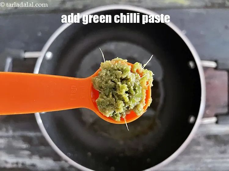 Step 17 – In the same oil, add&nbsp;<meta charset="UTF-8" />2 tsp&nbsp;<a href="glossary-green-chilli-paste-hari-mirch-ki-paste-mirchi-paste-333i">green chilli paste</a>.