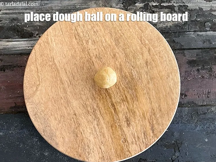 Step 21 – Place a dough ball on a rolling board.