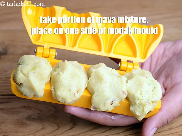 Step 17 – Take a portion of the mava mixture, place it on one side of the greased …